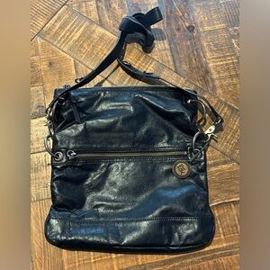 The Sak vintage black leather bag with floral  Interior. Great condition